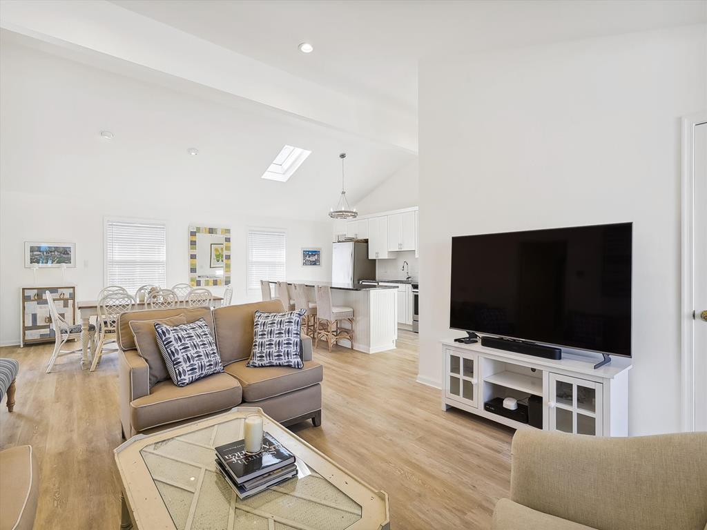 image This bright and airy space connects to the kitchen, enhancing the home's flow and making it an entertainer's dream.