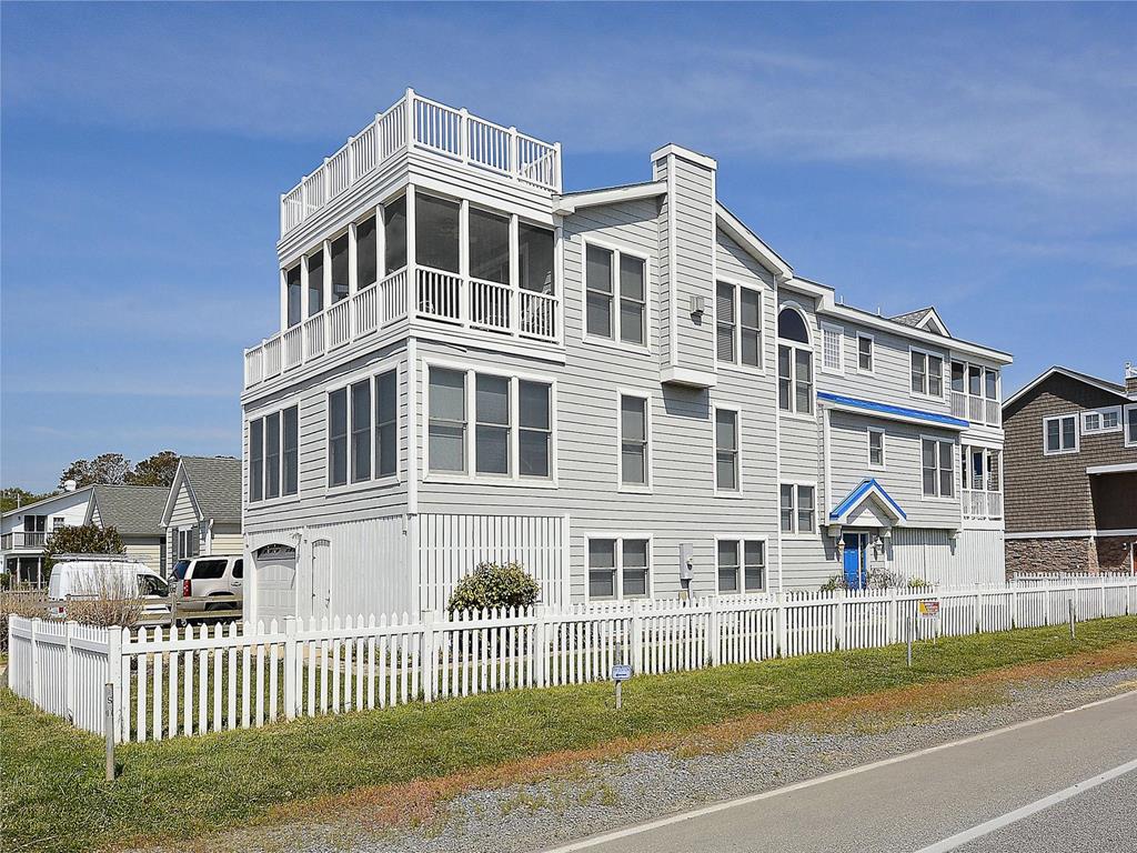 image This stunning luxury beach home boasts breathtaking ocean views, multiple porches, and ample deck space that invites relaxation in the coastal breeze.