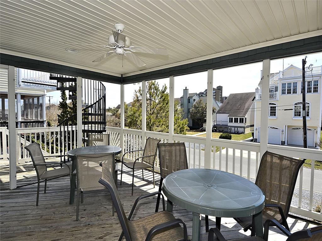 image Open-air deck with a dining set, great for outdoor meals with a view.