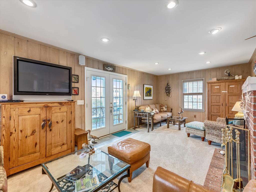 image The entertainment area offers a flat-screen TV and a comfortable layout for movie nights and family gatherings.