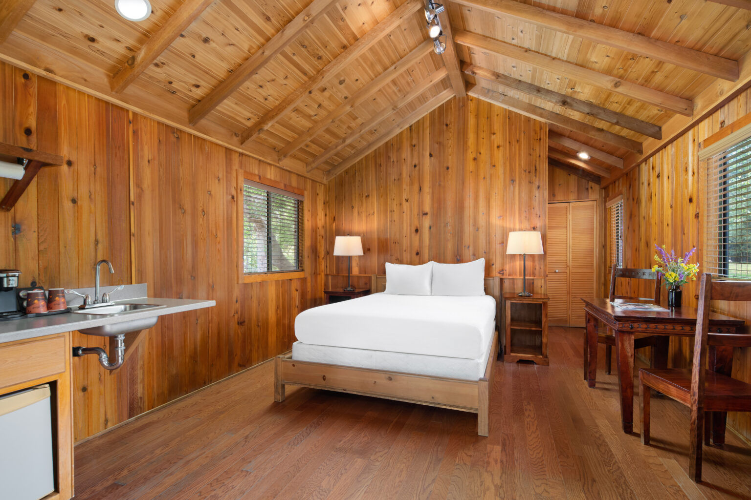 image Experience the warmth of rustic elegance with wood-paneled interiors, inviting decor, and modern comforts for a restful stay.