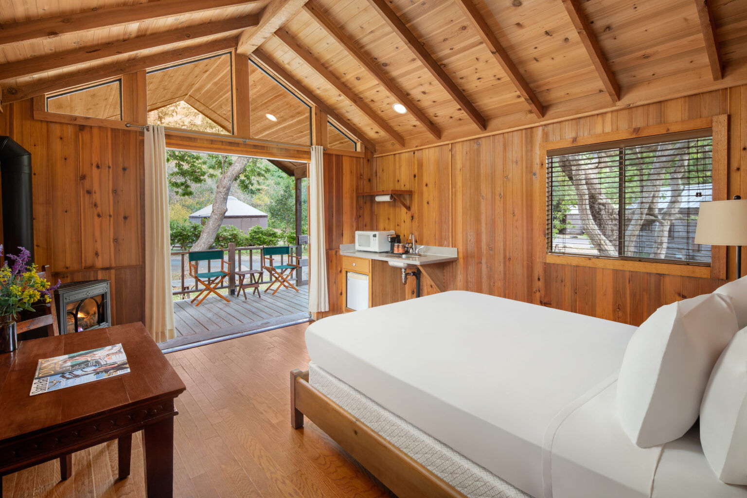 image Wake up to the beauty of the outdoors with large windows and an open layout that seamlessly blends indoor comfort with nature.