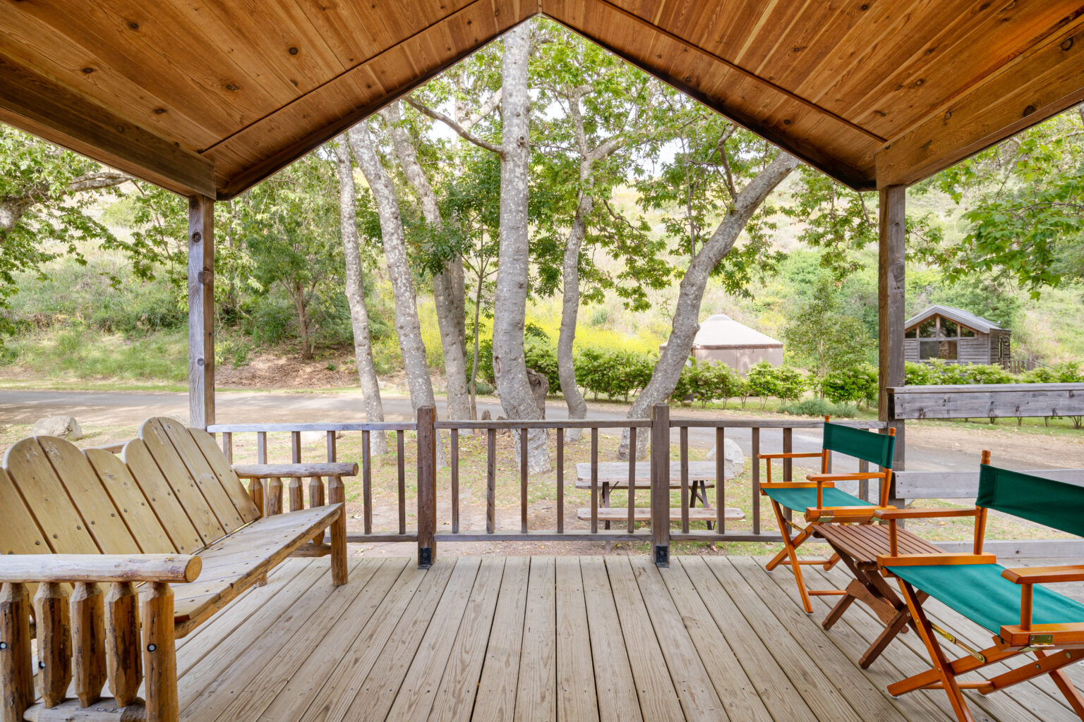 image Unwind on a private porch with cozy seating, where the fresh air and gentle sounds of nature create a relaxing retreat.