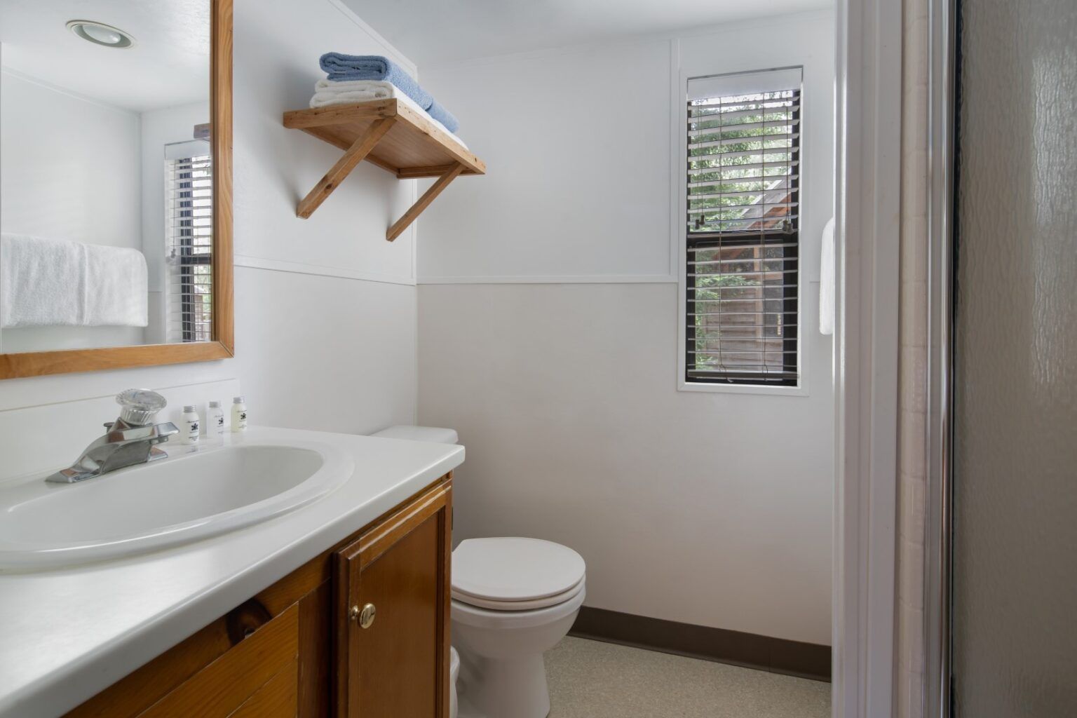 image Refresh and recharge in a bright and clean private bathroom, offering modern comforts amidst your nature retreat.