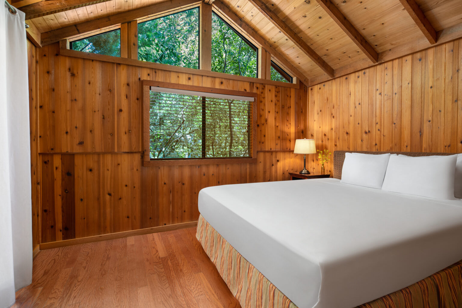 image Sleep soundly in a bright and airy bedroom, where large windows bring in stunning views and fresh canyon air.