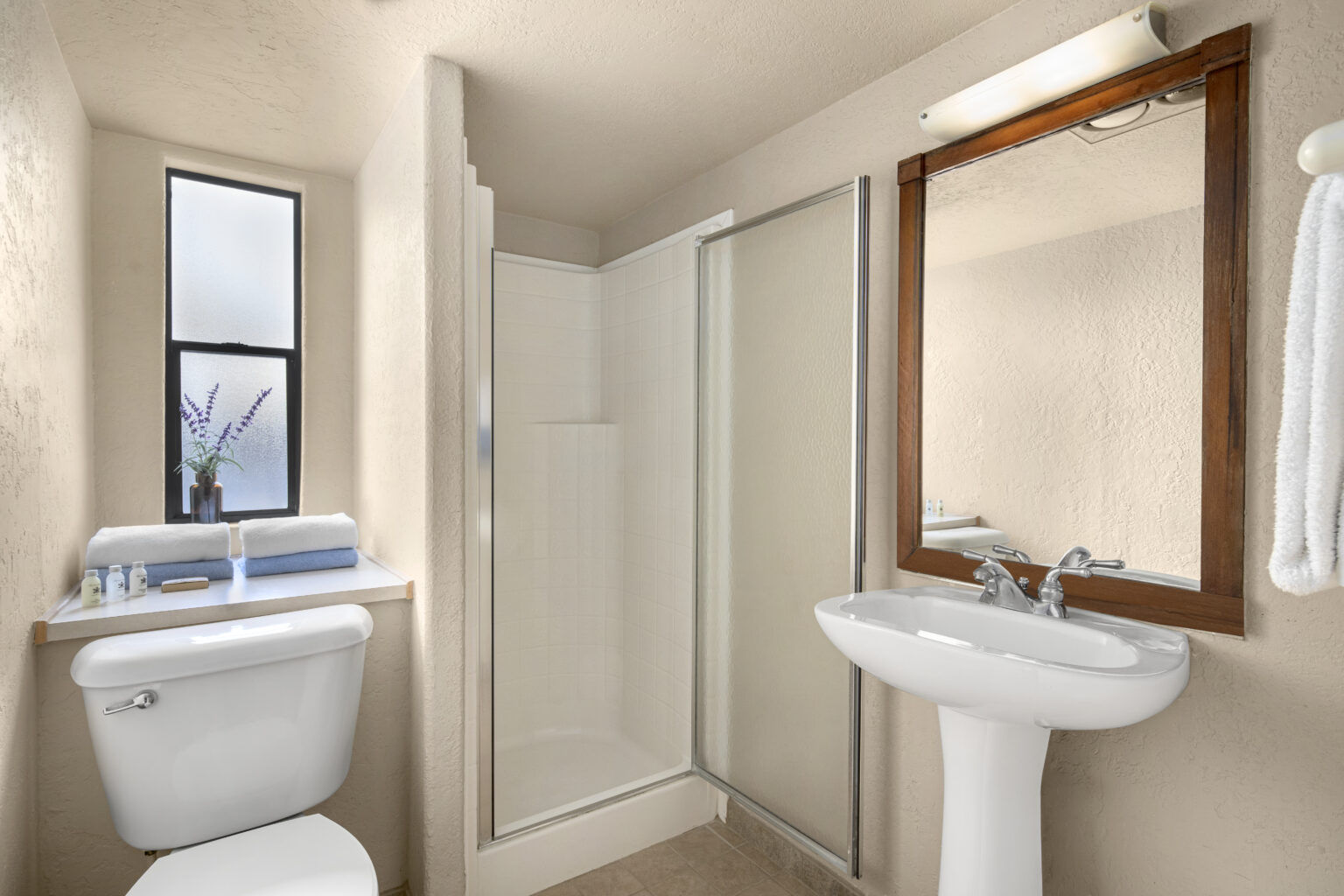 image Refresh in a clean and modern bathroom, offering comfort and convenience to enhance your glamping experience.