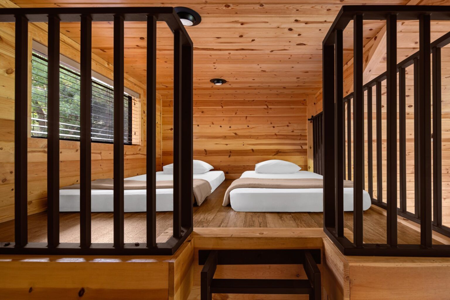 image Enjoy a unique lofted sleeping area, perfect for families or groups looking for a cozy and inviting stay.