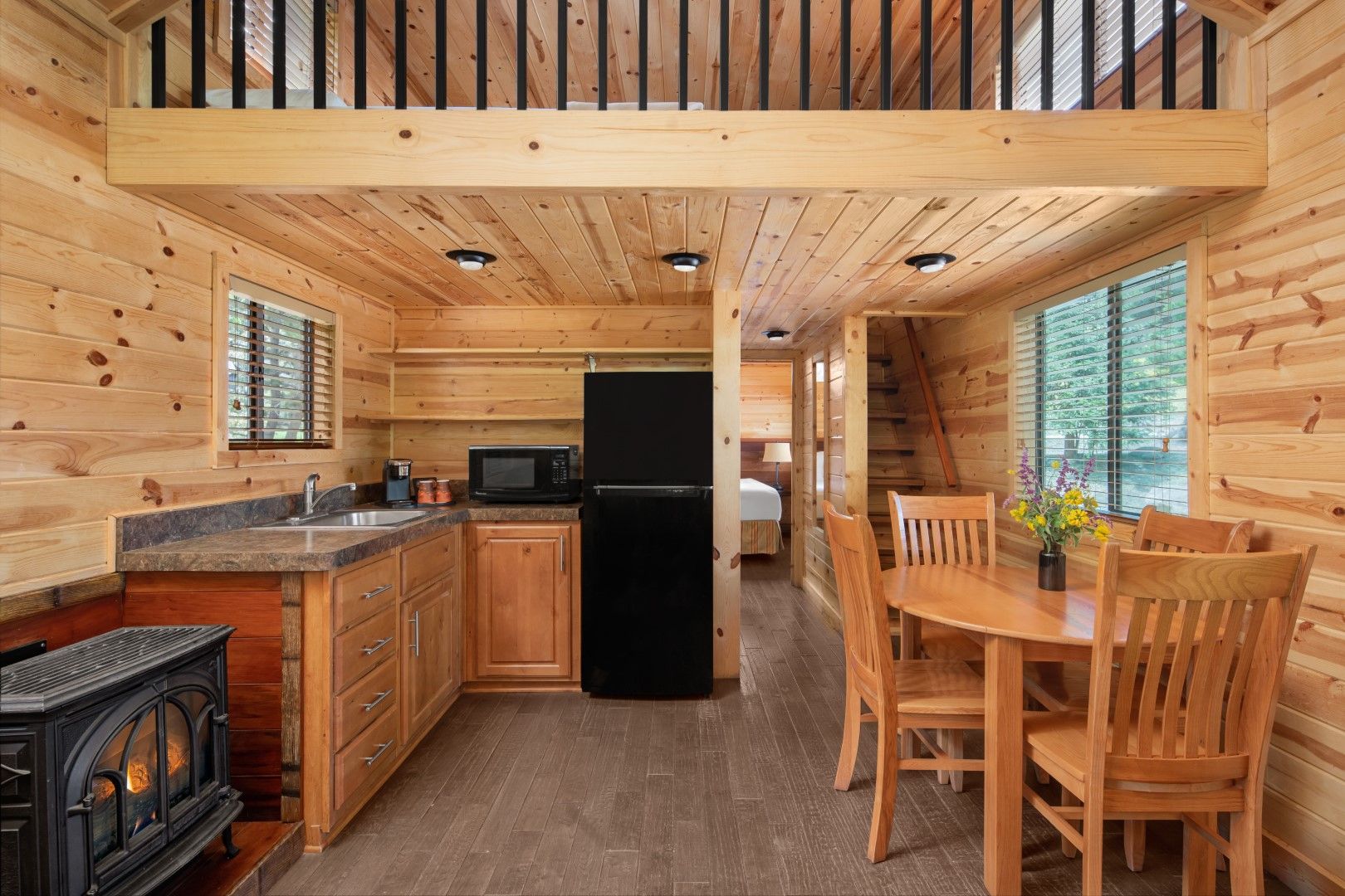 image Enjoy the convenience of a fully equipped kitchen and dining area, perfect for gathering and preparing meals together.