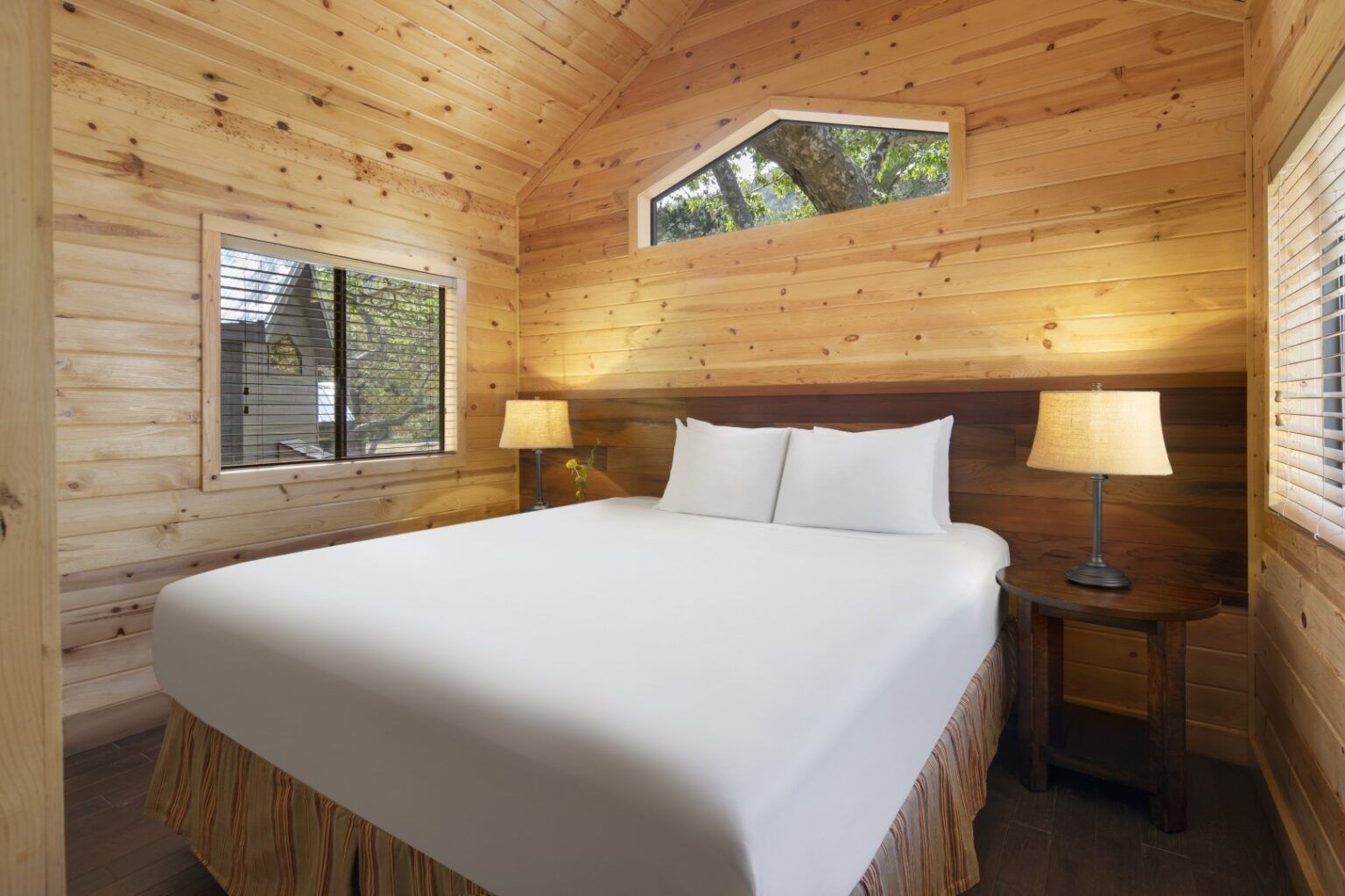 image Rest peacefully in a cozy bedroom with warm wood tones, soft lighting, and serene views of the surrounding canyon.