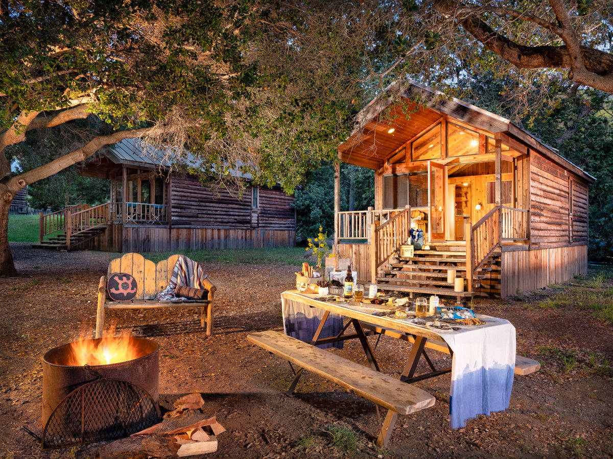 image Creekside Double blends rustic comfort and scenic charm—just steps from El Capitan Creek, with cozy interiors and fire-lit evenings outside.