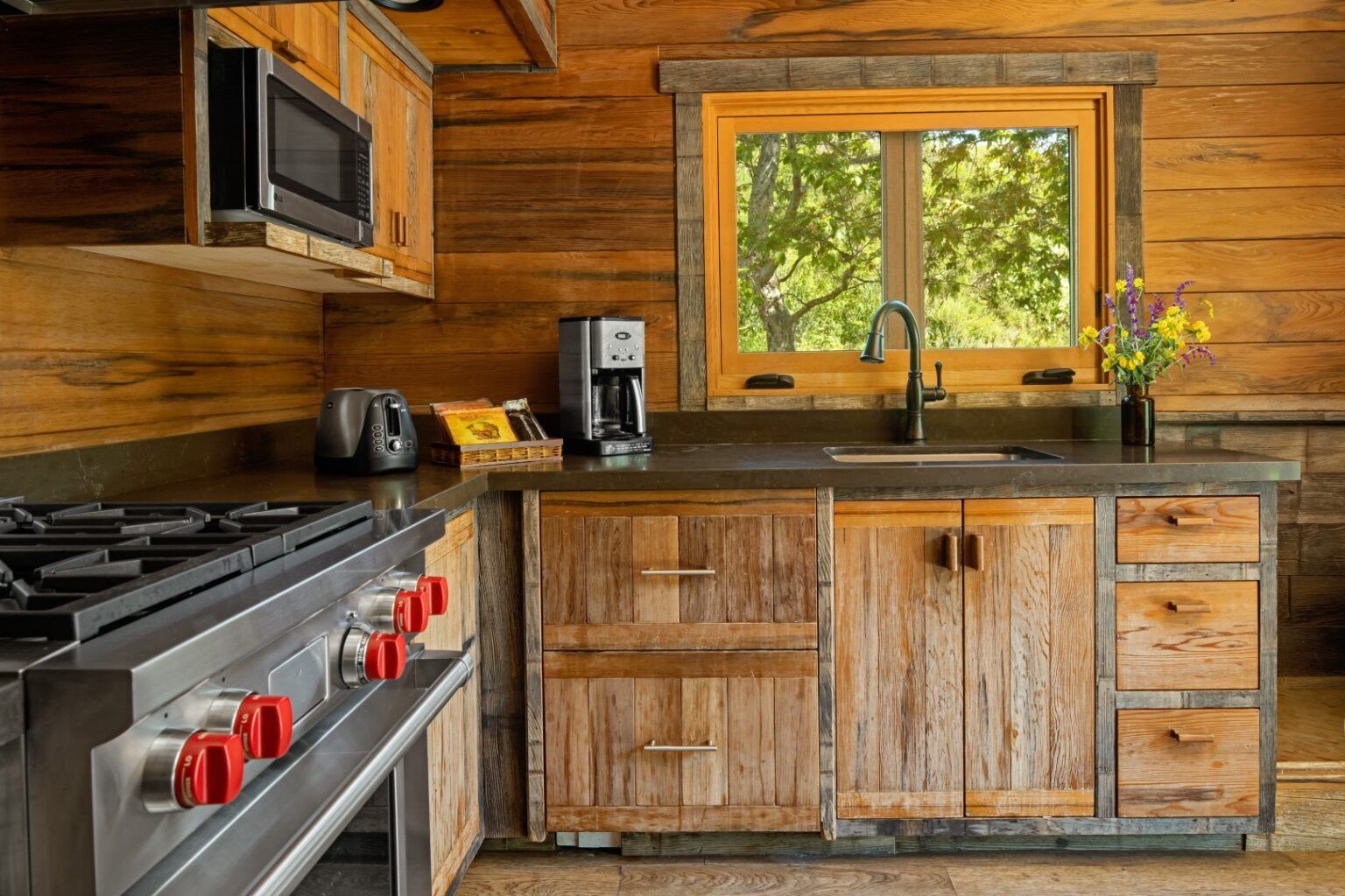 image Cook up something delicious in this beautifully rustic kitchen, blending natural wood textures with modern appliances for a perfect culinary space.