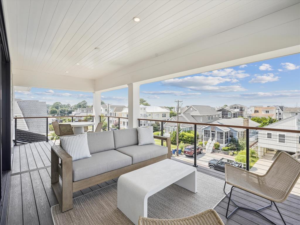 image Enjoy delightful outdoor moments on this expansive deck, surrounded by a blend of comfort and modern aesthetics.