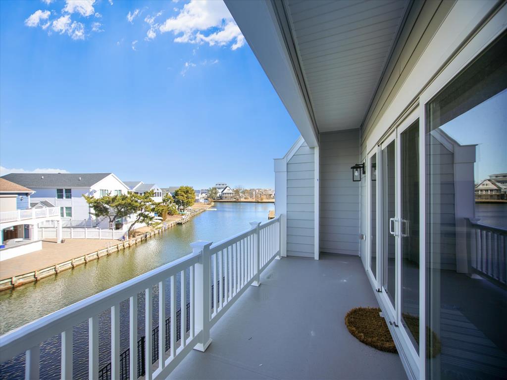 image Step out onto the balcony to experience gorgeous canal views, perfect for those seeking a peaceful retreat close to the beach.