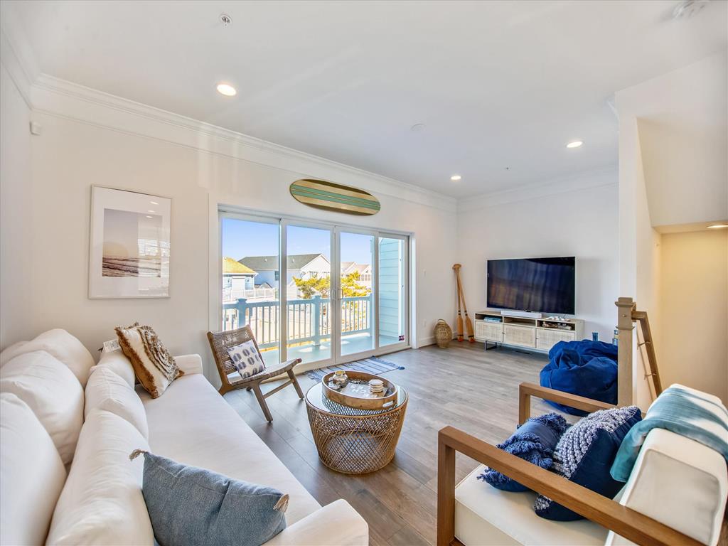 image This elegantly designed living space offers a cozy retreat with comfortable seating and ample natural light, perfect for taking in the tranquil surroundings.