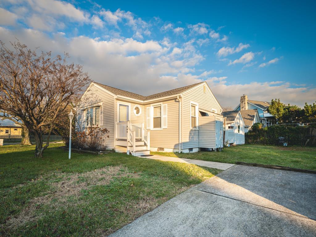 image This charming beach cottage features freshly painted exteriors, new flooring, and ample yard space, providing a cozy retreat just moments from the shoreline.