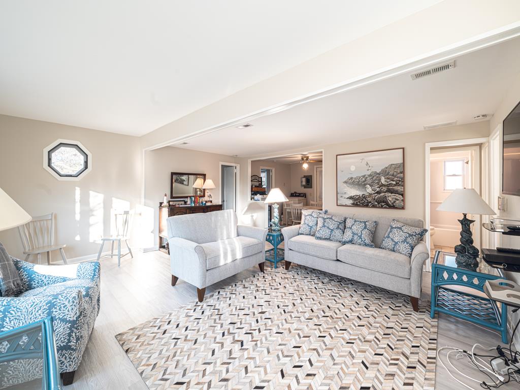 image The inviting living room, adorned with stylish new furniture, is the perfect place to gather and unwind.