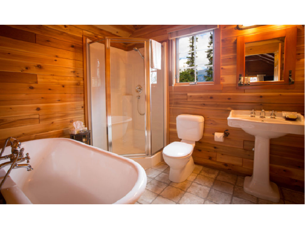 image A beautifully crafted bathroom with natural wood accents provides a tranquil setting to refresh and unwind.
