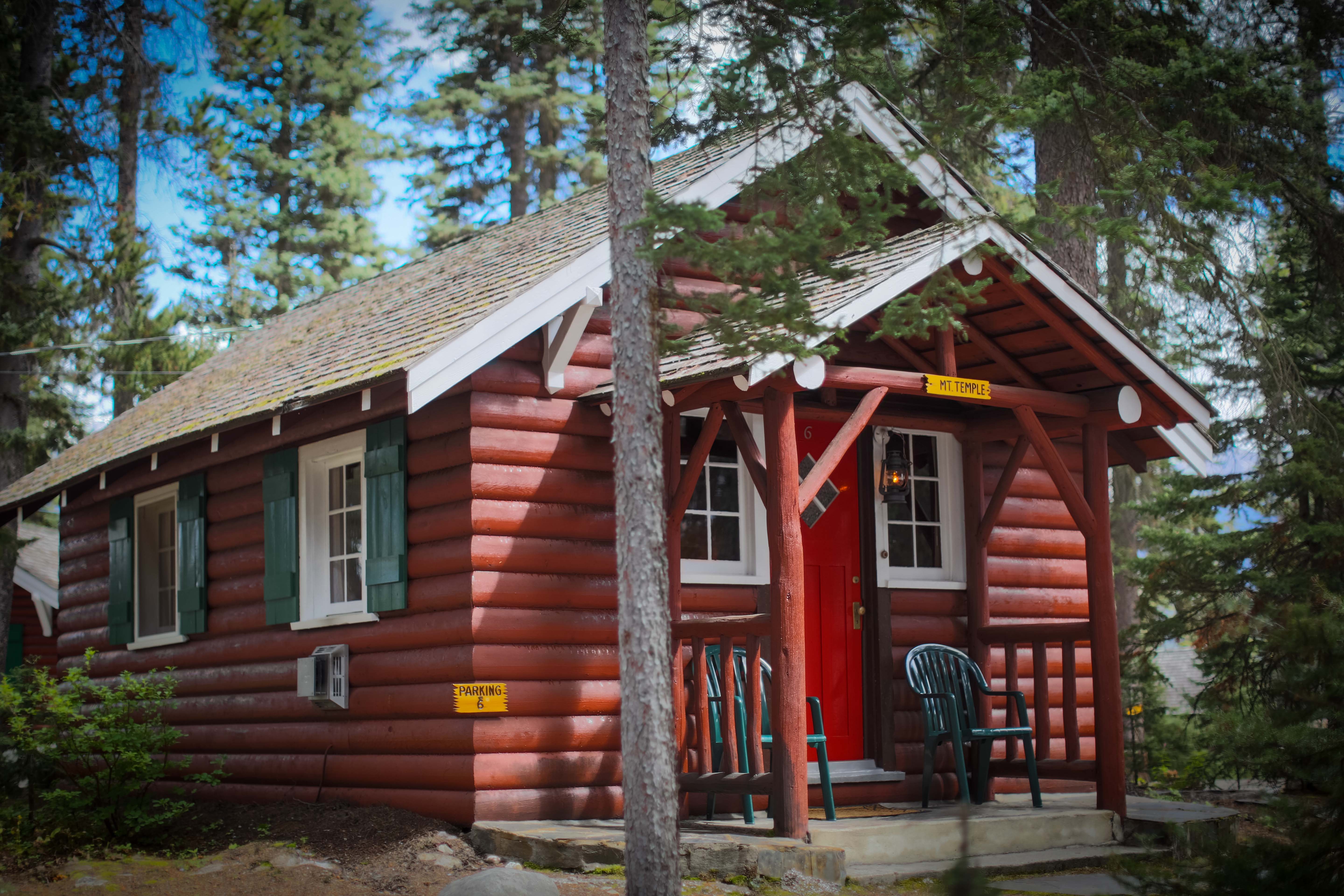 image A charming heritage cabin nestled among the trees, offering a peaceful retreat in the heart of nature.