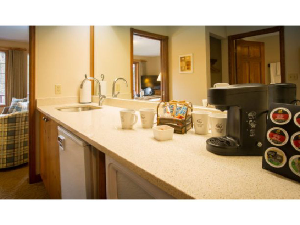 image A well-appointed kitchenette offers convenience and comfort, perfect for a relaxing morning coffee or a quiet evening in.