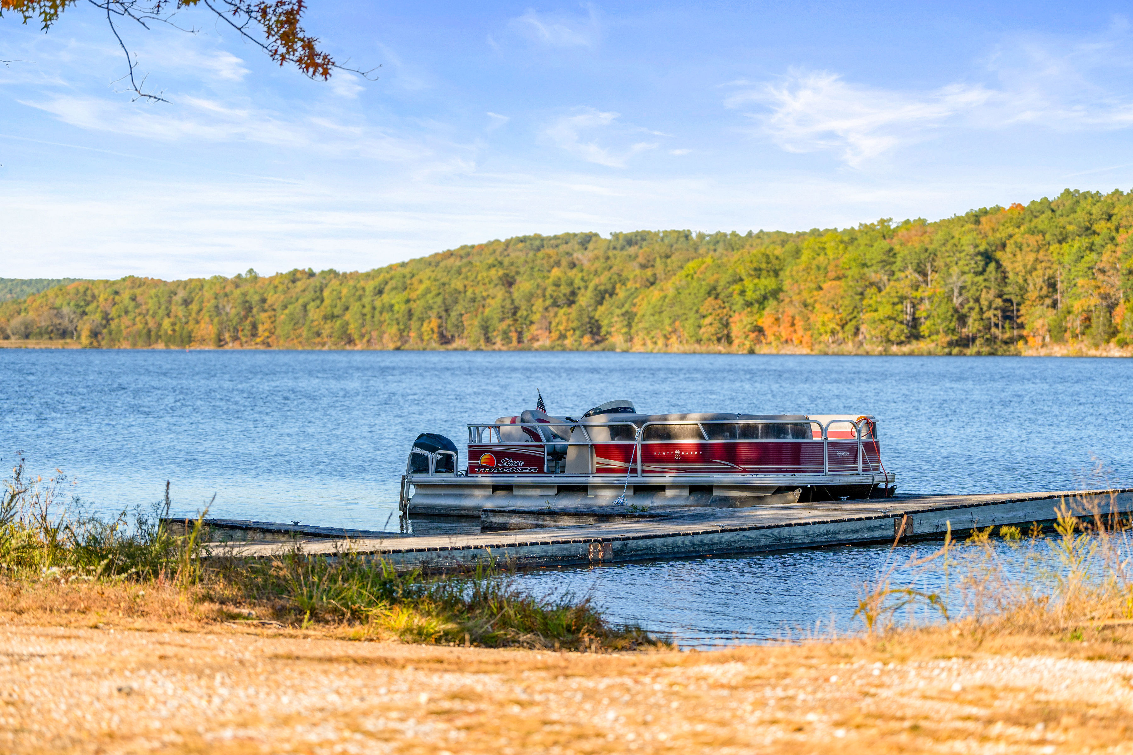 image Scenic boat tour on Sunnen Lake, offering a relaxing way to explore the water while enjoying fishing, kayaking, or paddleboarding nearby.