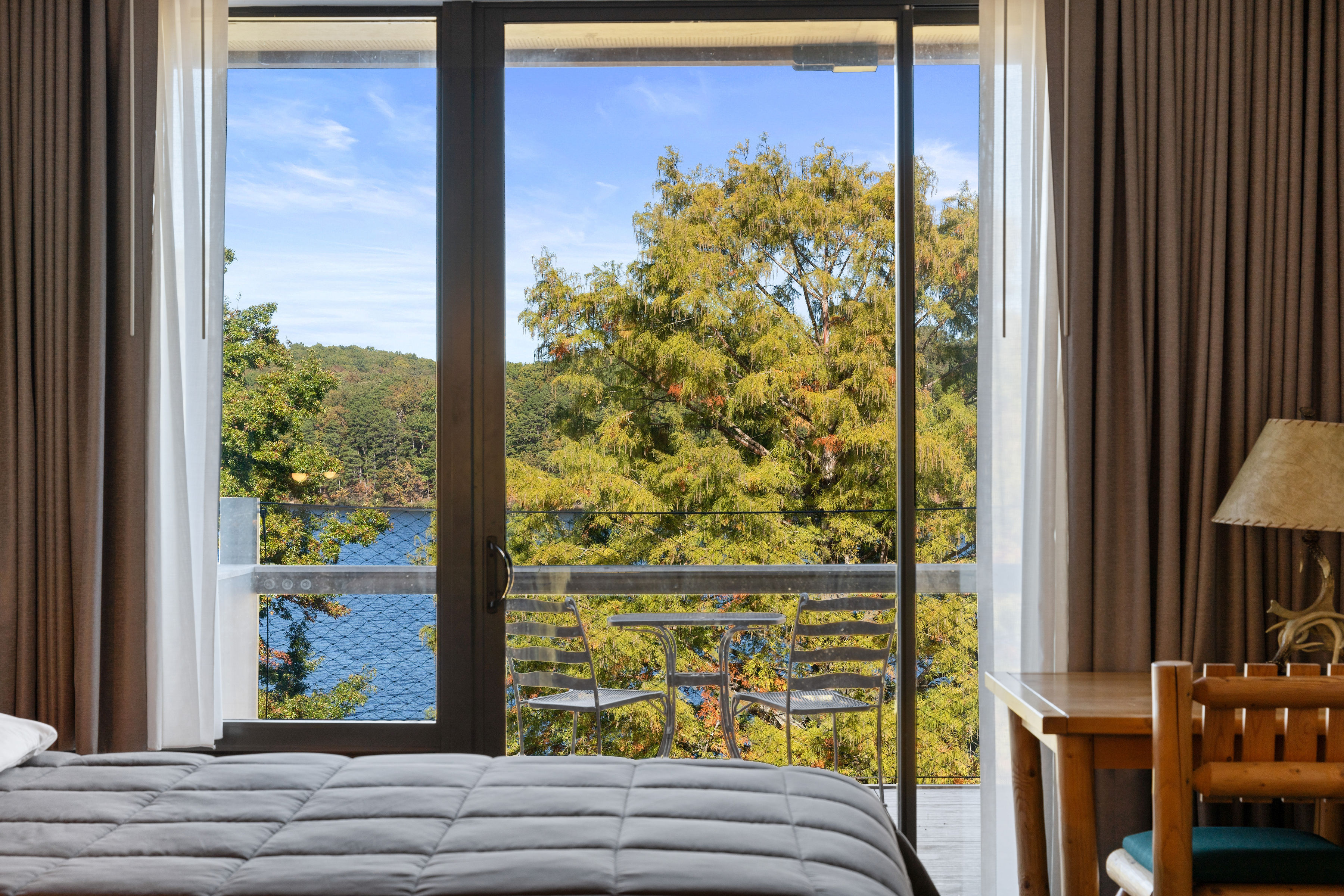 image Floor-to-ceiling windows bring in natural light and frame the picturesque lake views.