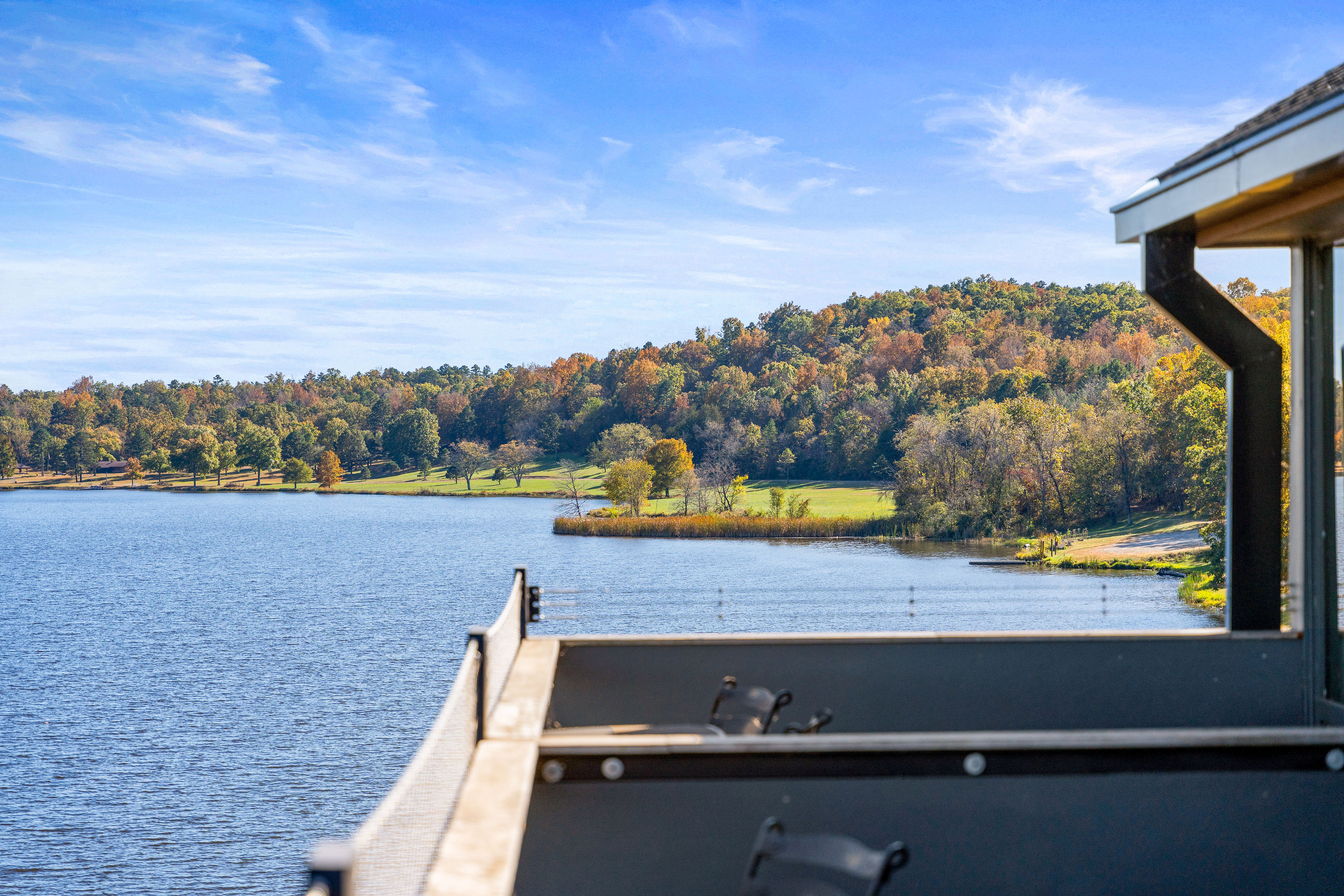 image Stunning lakefront views from your private deck, ideal for enjoying a morning coffee or sunset drinks.
