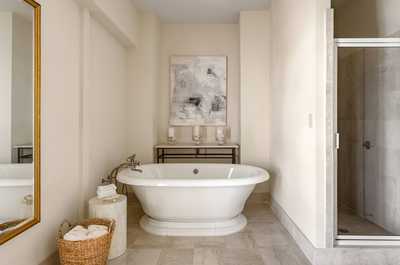 A spa-like retreat, featuring timeless elegance and a freestanding tub for ultimate relaxation.