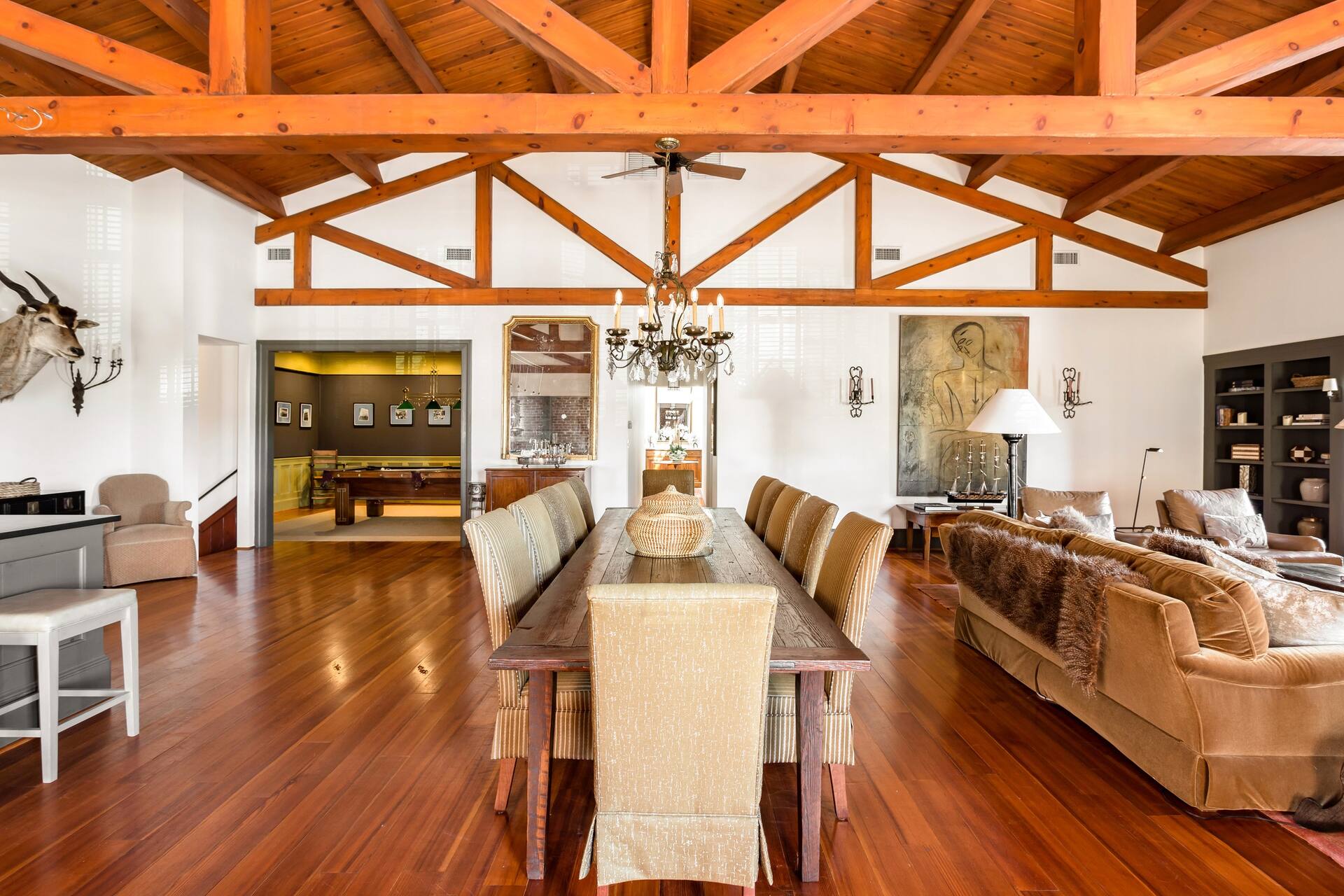 image Gather in style beneath exposed beams and soaring ceilings, where modern elegance meets timeless Charleston charm.
