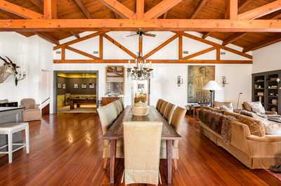 Gather in style beneath exposed beams and soaring ceilings, where modern elegance meets timeless Charleston charm.