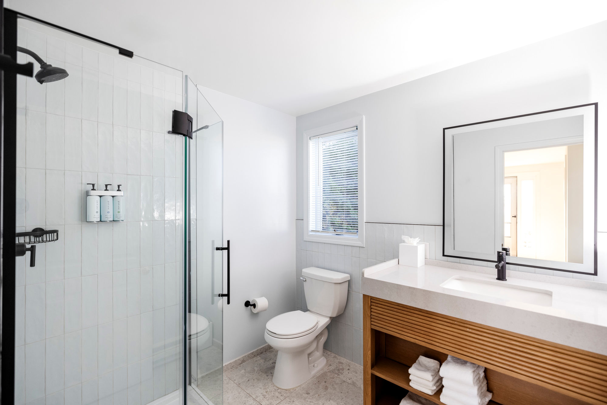 image Refresh in a bright, spa-like space where clean lines and soft light create the perfect start—or end—to your day.