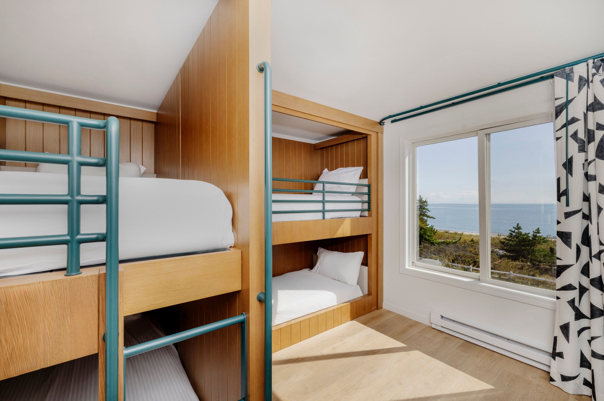 image Let the little ones wake to waves and wanderlust in a cheerful bunk room with views that inspire adventure.