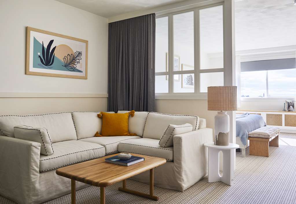image Experience the inviting atmosphere of the cozy living area featuring a plush sofa bed and stylish decor.