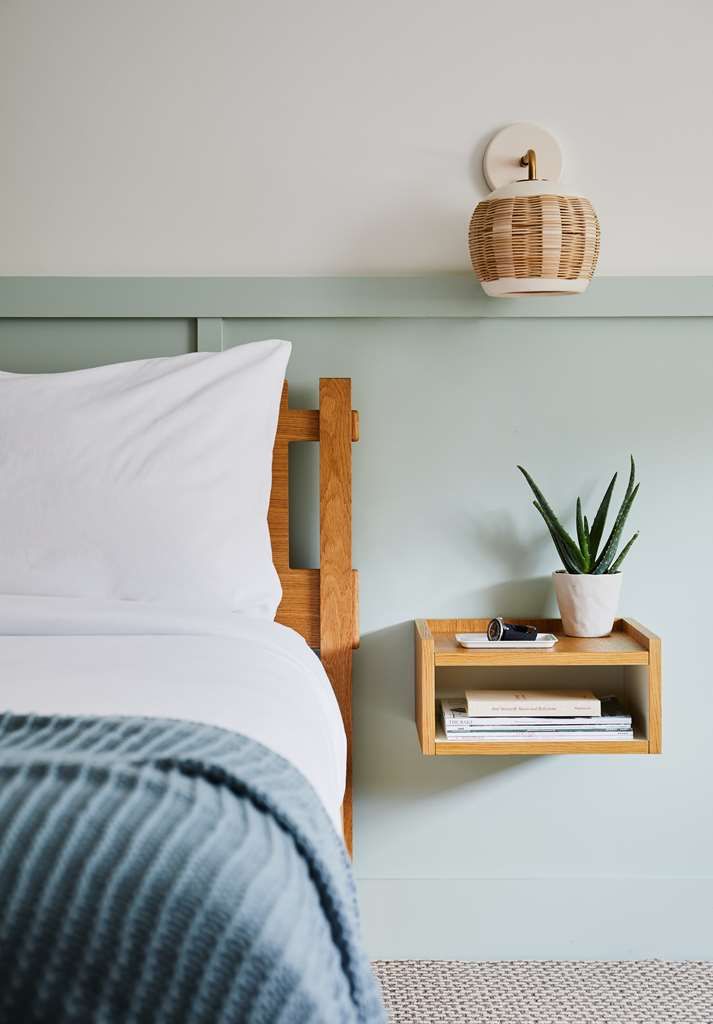 image Rest in the charming queen bedroom, designed with comfort and warmth to enhance your stay.