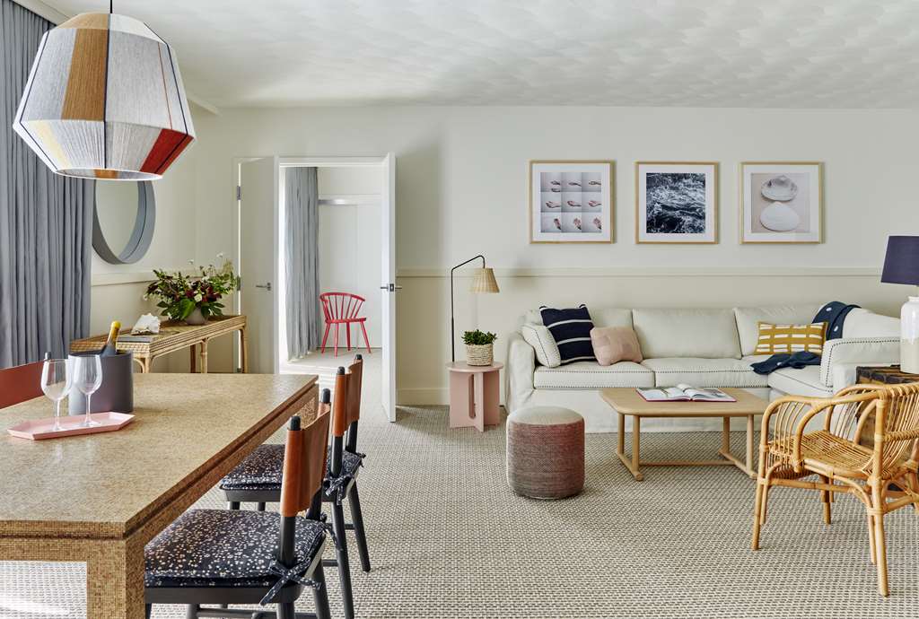 image The spacious living room invites relaxation with a comfortable sofa bed, providing an ideal space for family gatherings.