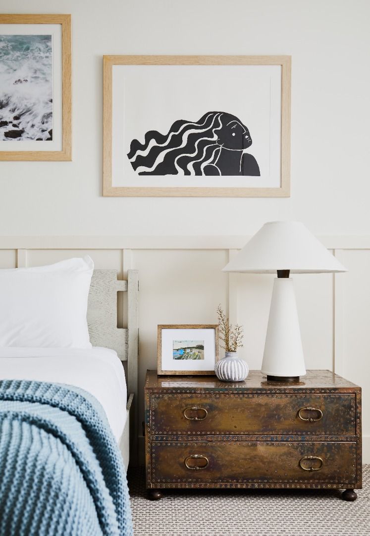 image Unwind in the stylish king bedroom, featuring elegant artwork and a serene atmosphere for restful nights.