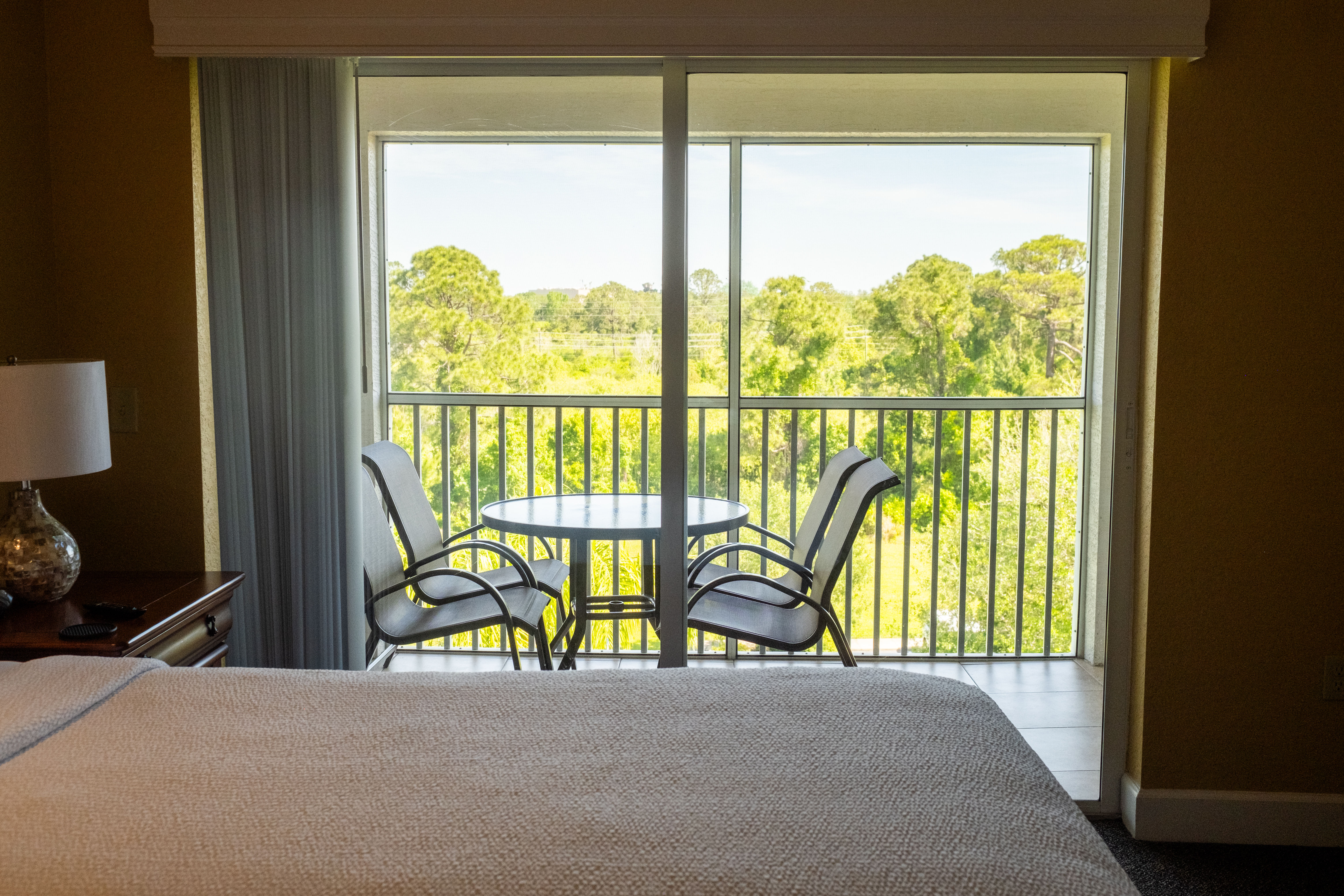 image Enjoy a private furnished balcony with stunning views, inviting you to unwind in the fresh air.