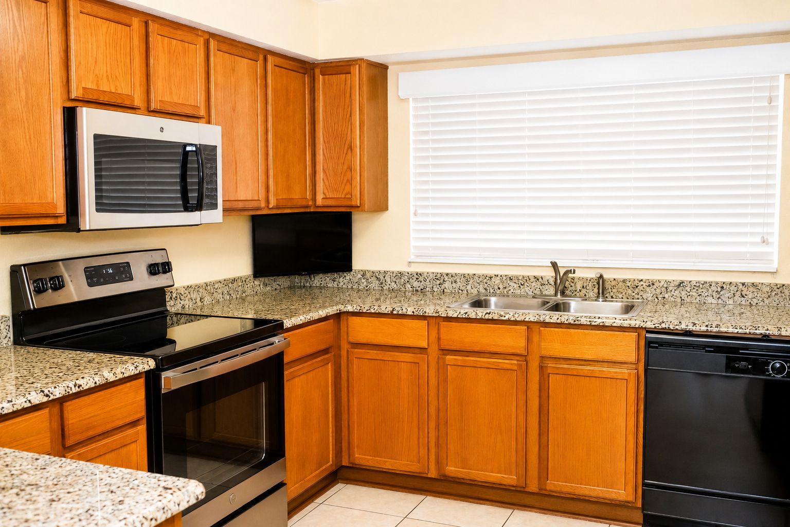 image Cooking is a breeze in this fully equipped kitchen, complete with stainless steel appliances and a spacious granite countertop for dining.