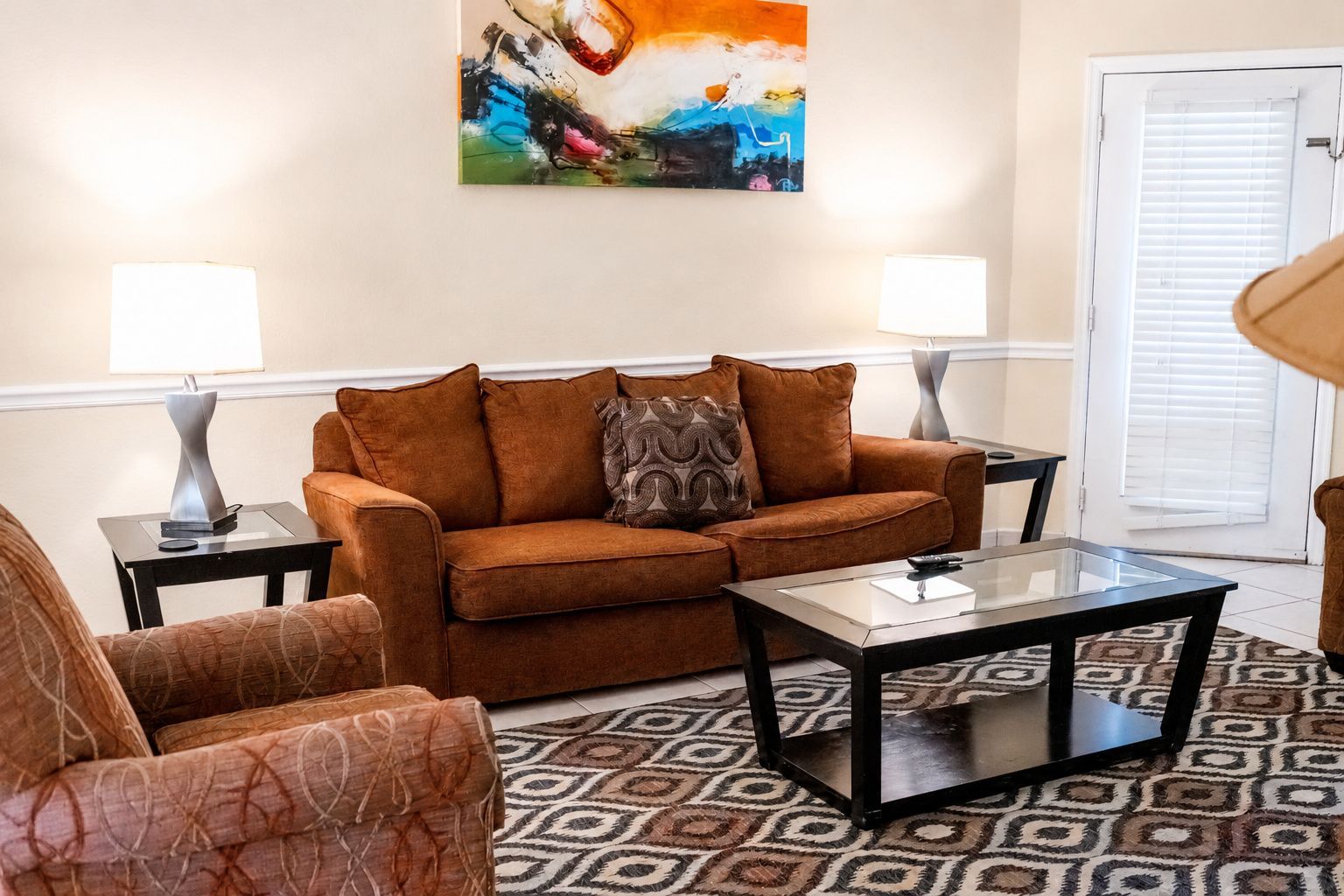 image The inviting living area, adorned with comfortable seating and vibrant decor, is perfect for relaxing and enjoying quality time with family or friends.