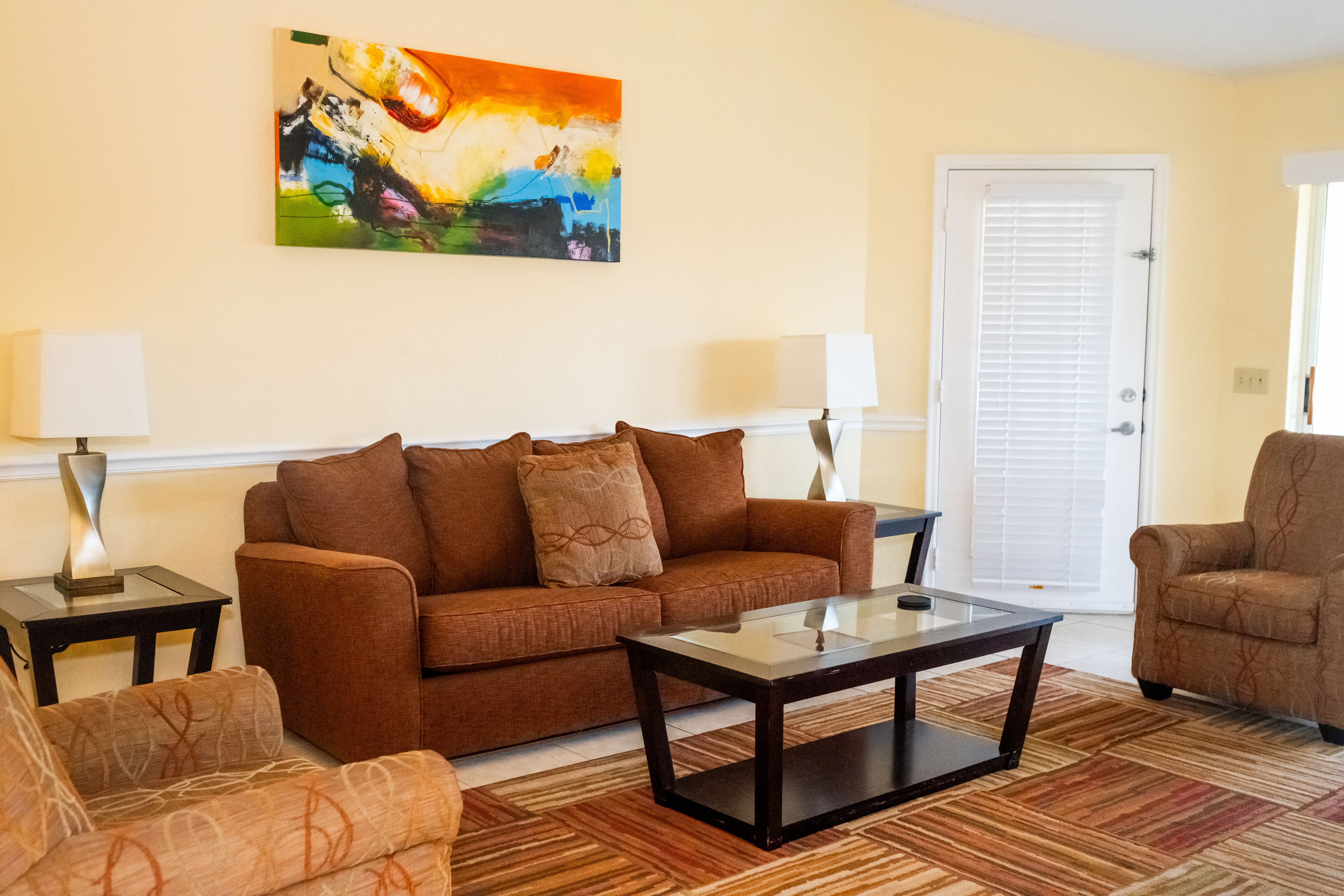 image The inviting living area, adorned with comfortable seating and vibrant decor, is perfect for relaxing and enjoying quality time with family or friends.