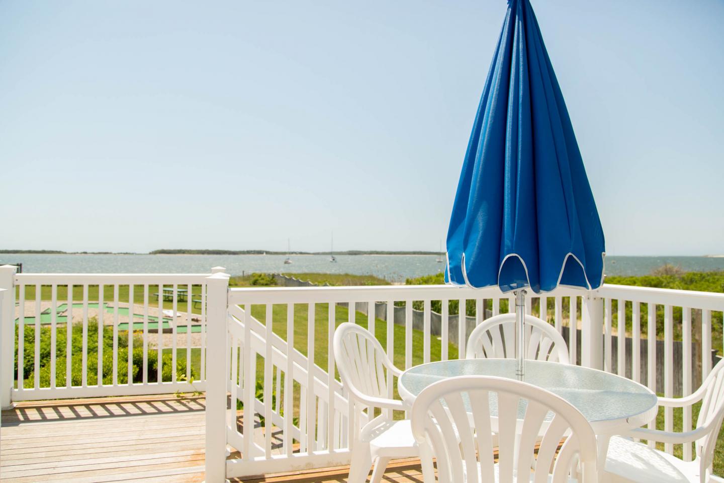 image Enjoy tranquil mornings or lazy afternoons with sweeping harbor views and the gentle rustle of sea grass below.
