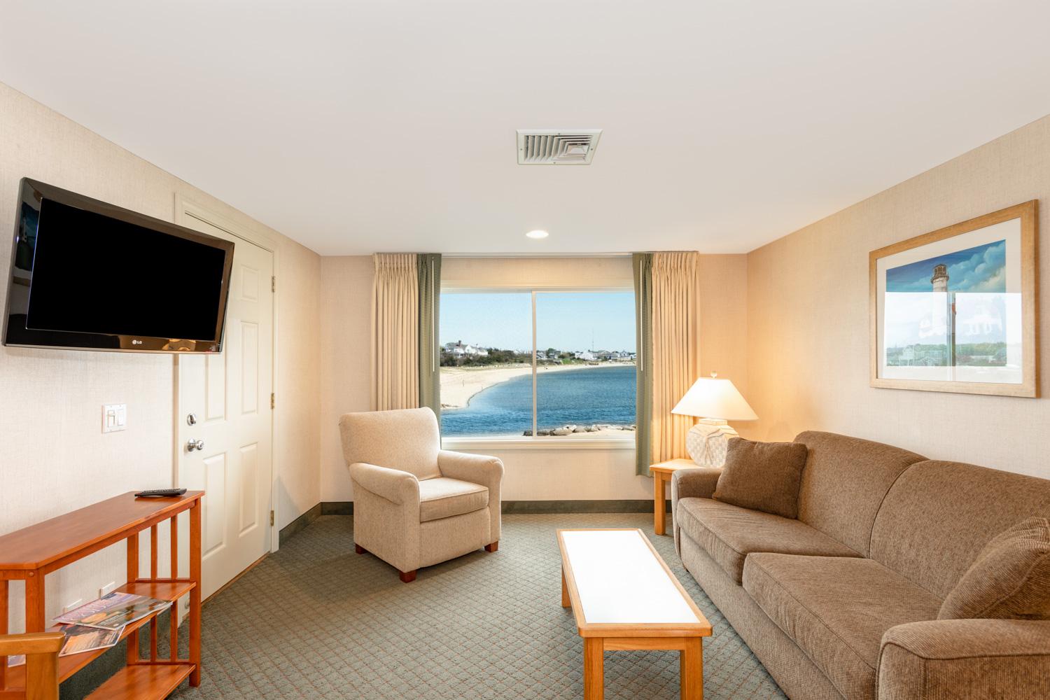 image Lounge with a view where coastal light pours in and every glance out the window invites you to the shoreline.