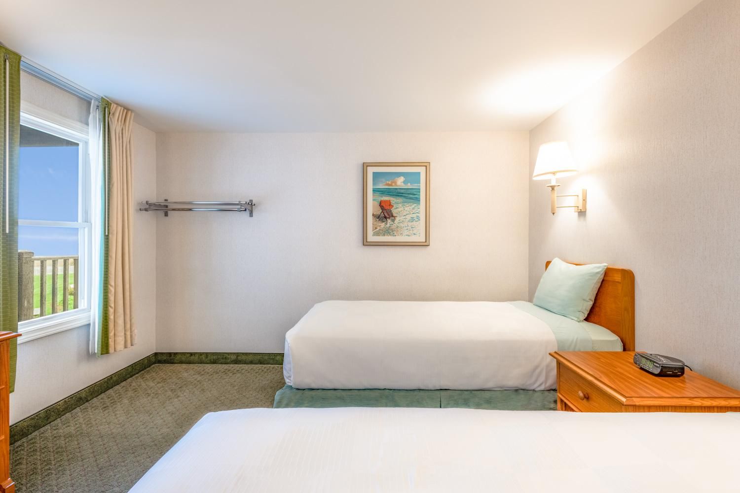 image Wake to coastal light and soft sea breezes in a room designed for calm and connection.