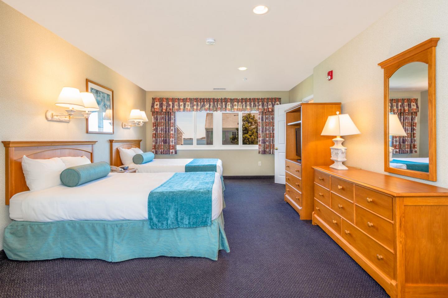 image Let coastal comfort meet classic charm in a room designed for both rejuvenation and relaxation.