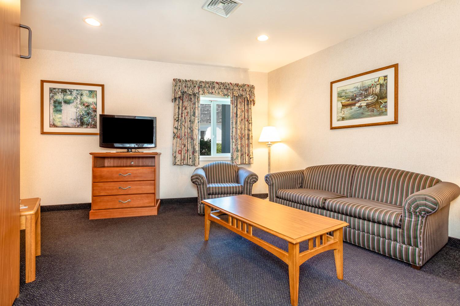 image Settle into a welcoming space where you can kick back after beach days and enjoy Cape Cod evenings in comfort.