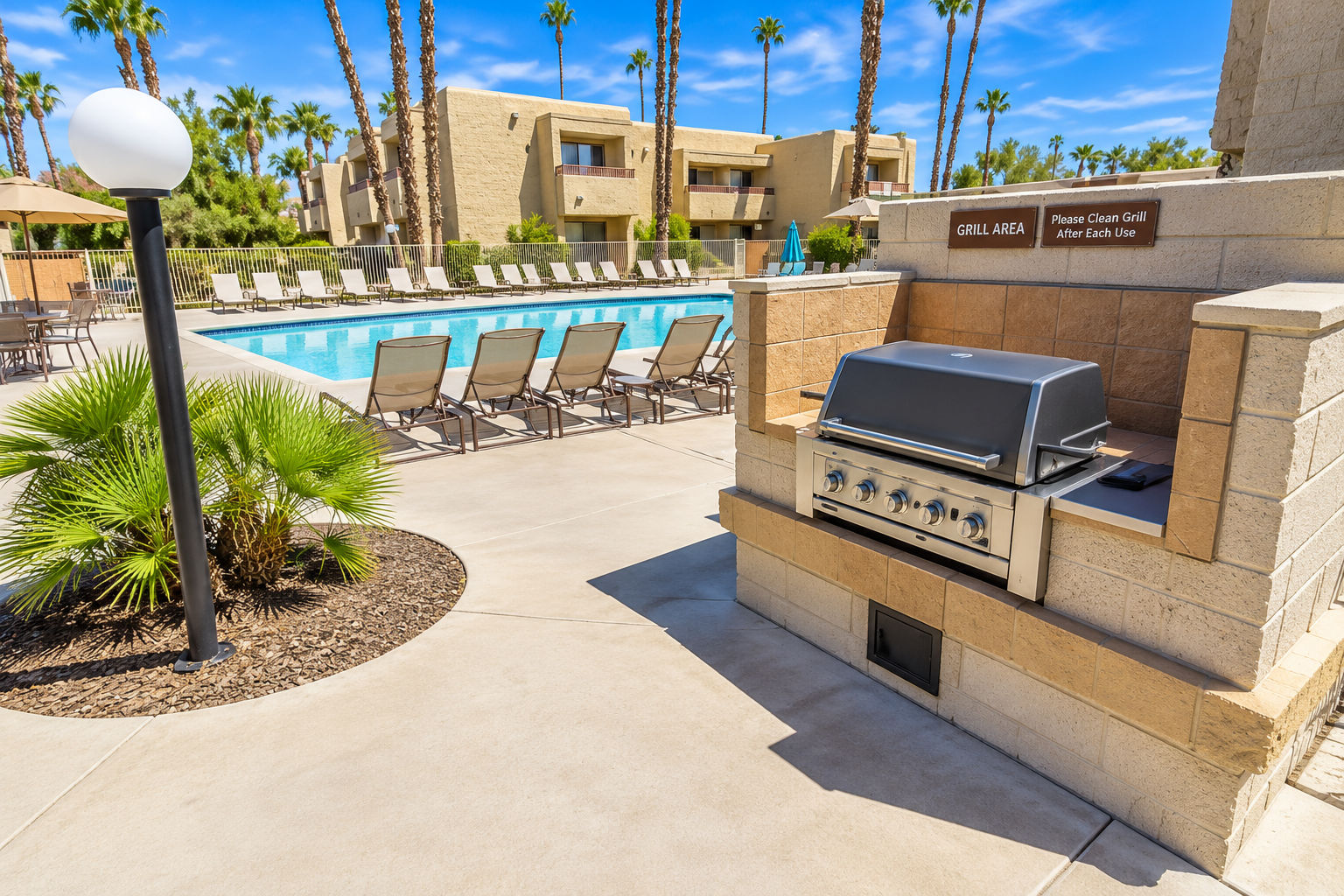image Outdoor grill area beside the pool