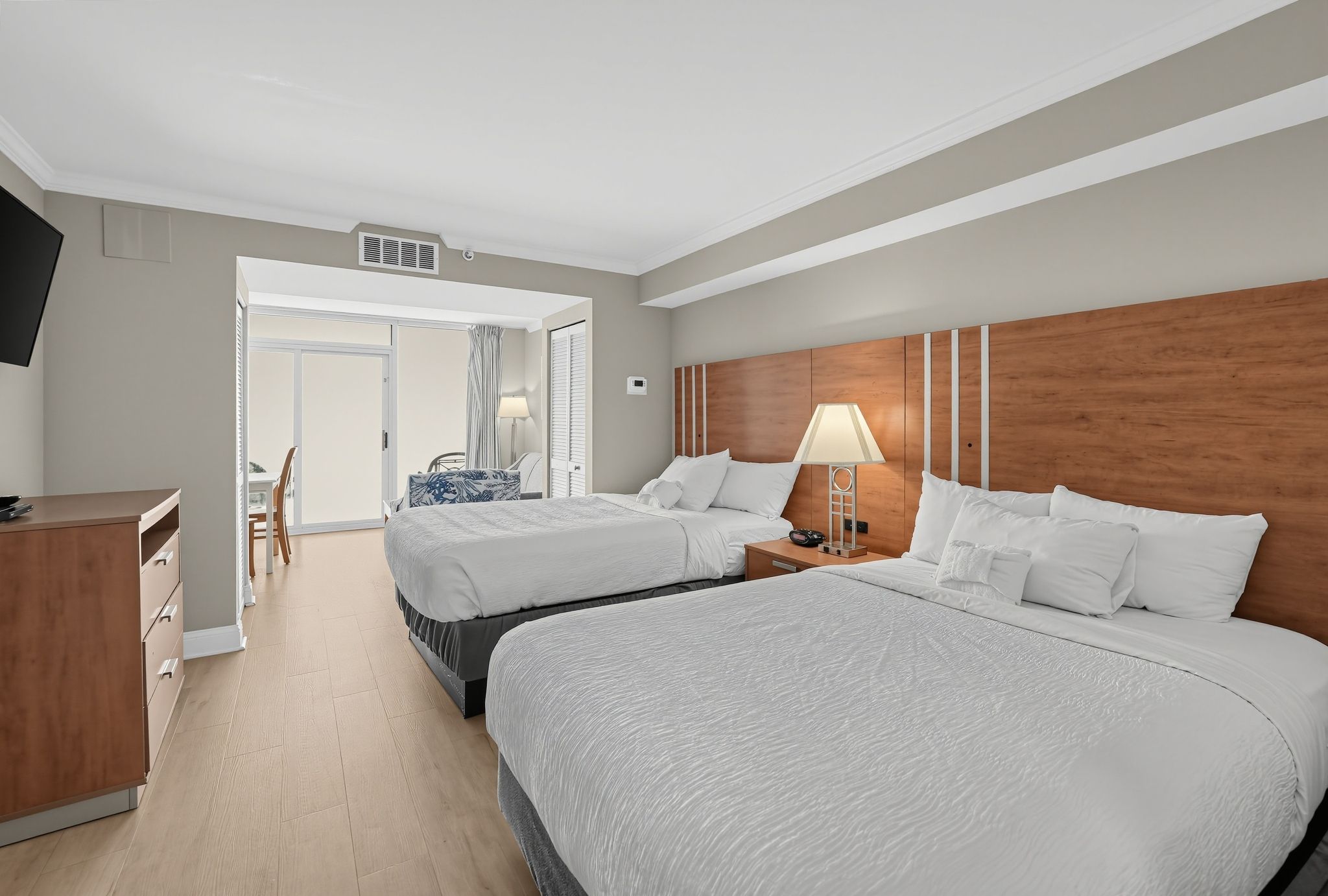 image Room with two beds and a small table