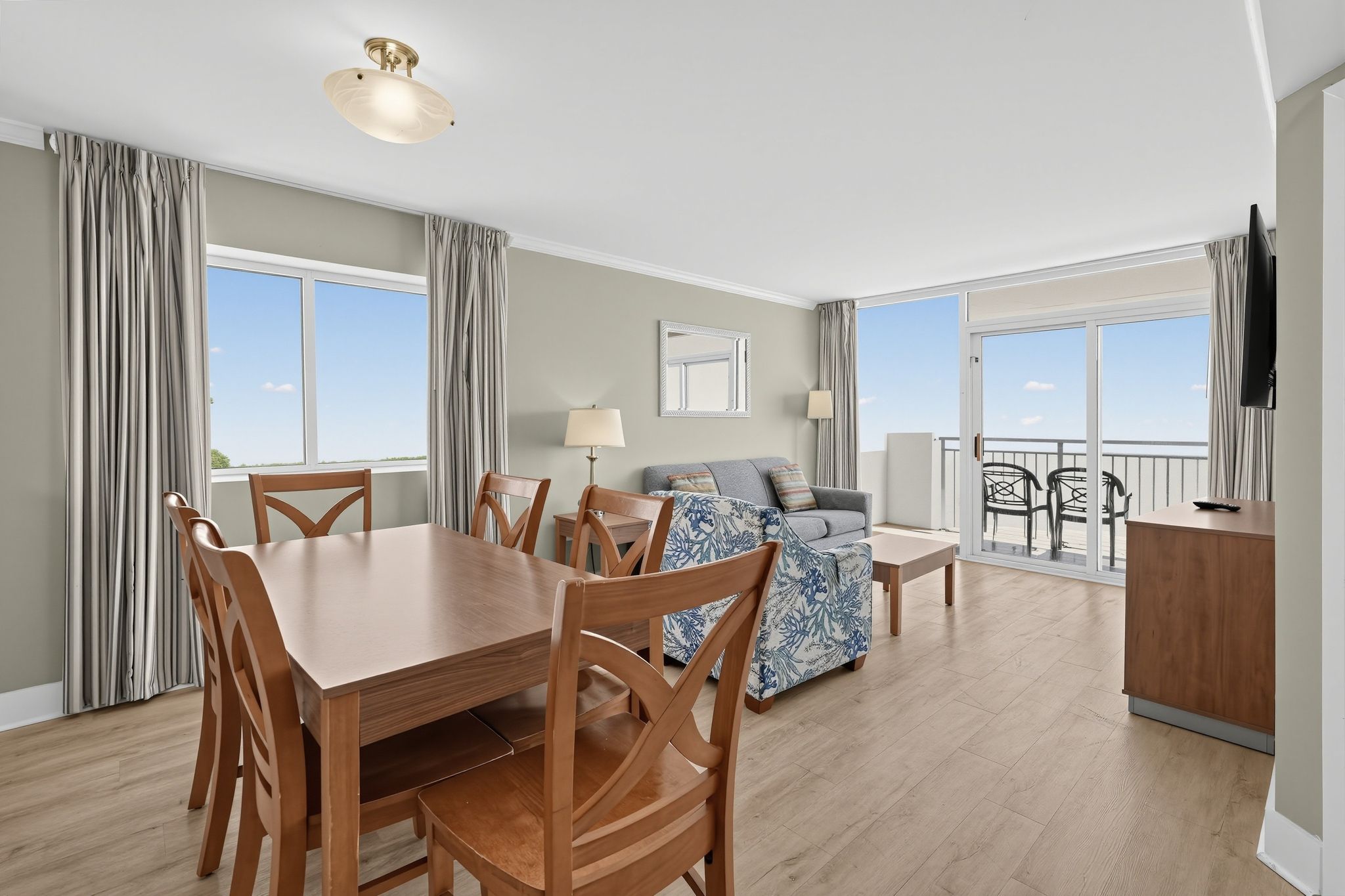 image Living area with dining table and ocean view