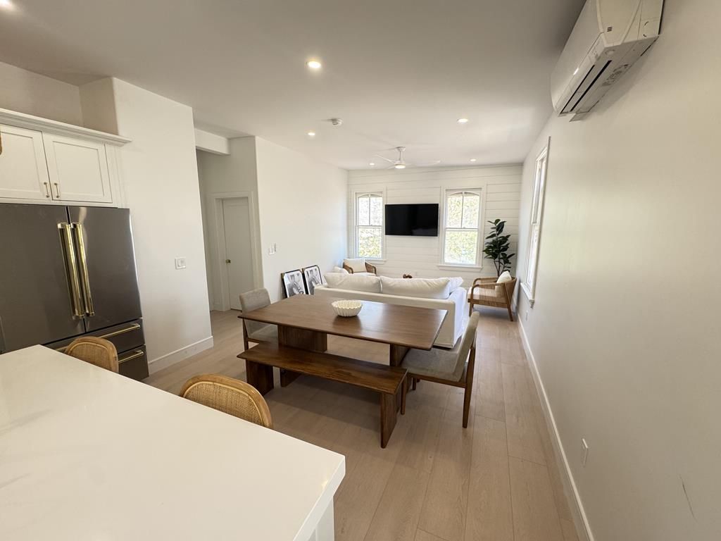 image Open-concept kitchen, dining, and living space designed for comfort and connection.