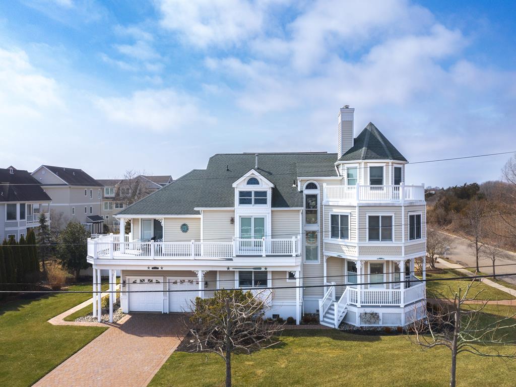 image This stunning property boasts ocean views, a wrap-around porch, and a rooftop deck, perfect for soaking in the Cape May coastal charm just minutes from the beach.