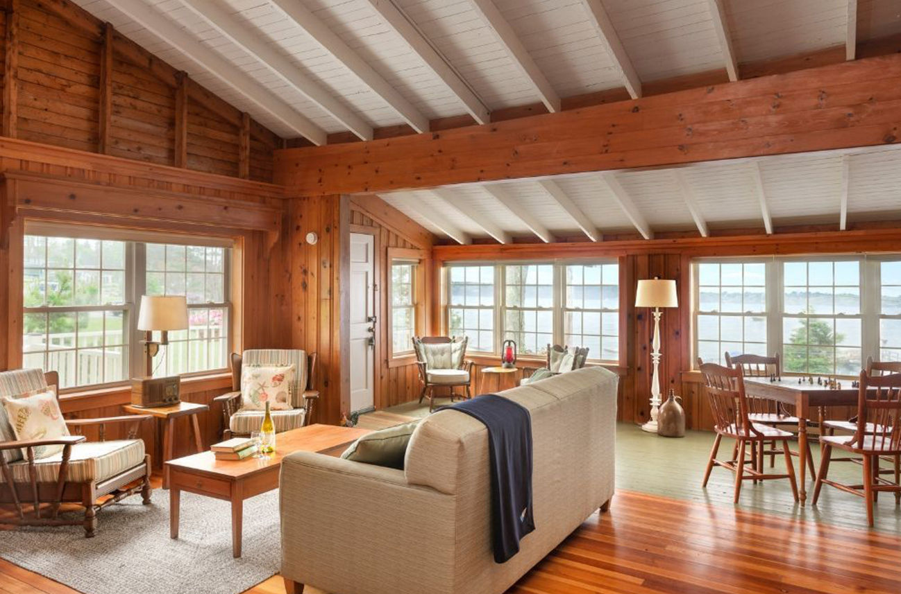 image Step into warm wood tones and coastal charm, where comfort and conversation flow as easily as the ocean breeze.